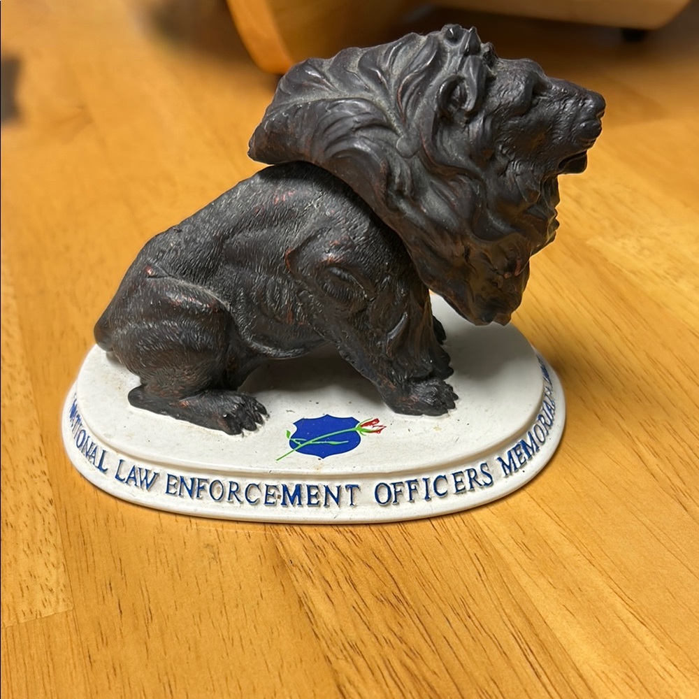 Bobble head lion on white base